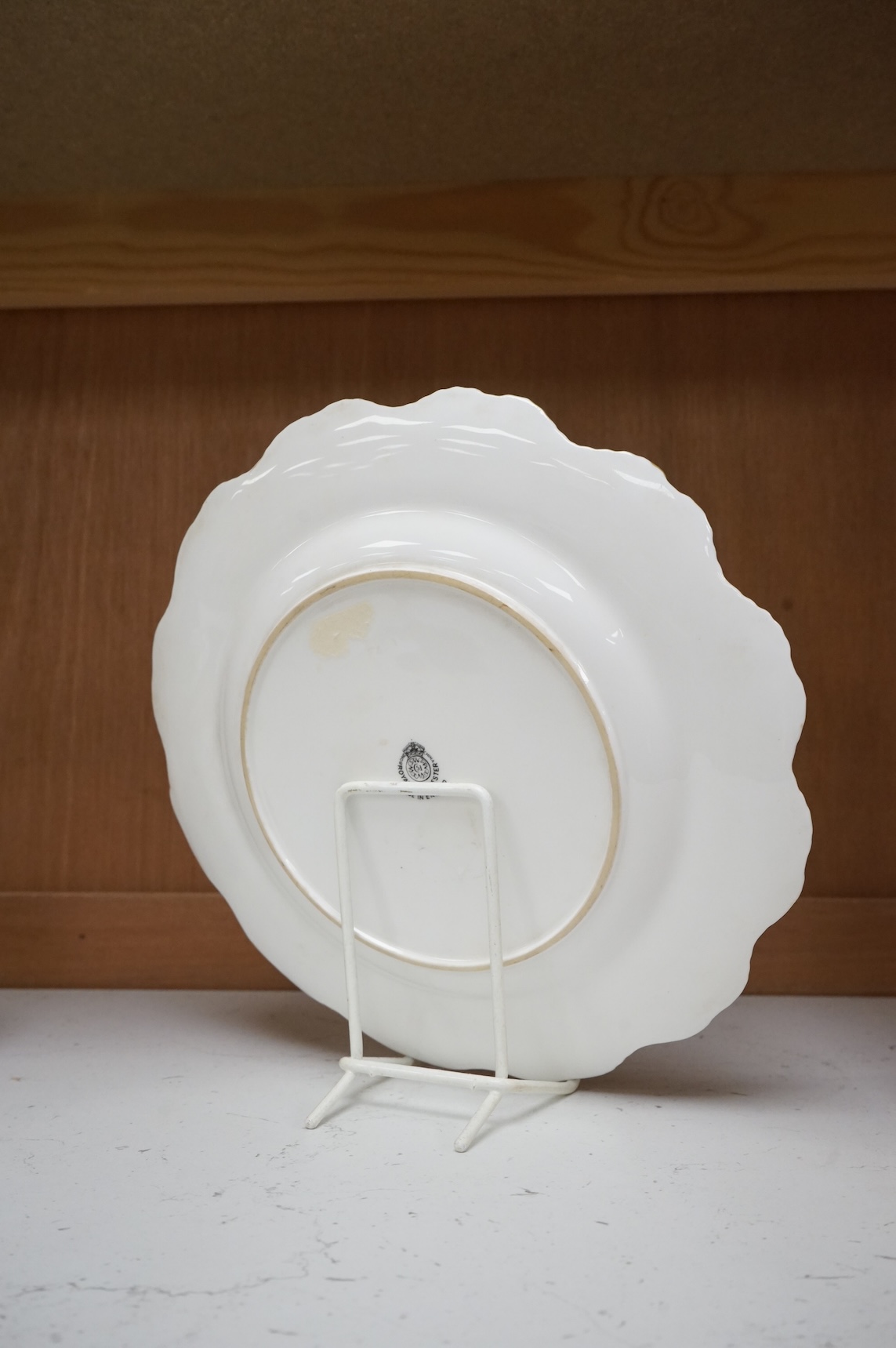 A Royal Worcester cabinet plate, painted with fruit by Harry Ayrton, signed, 22cm diameter.